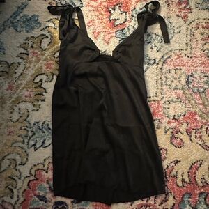 Black satin mini dress! The straps tie